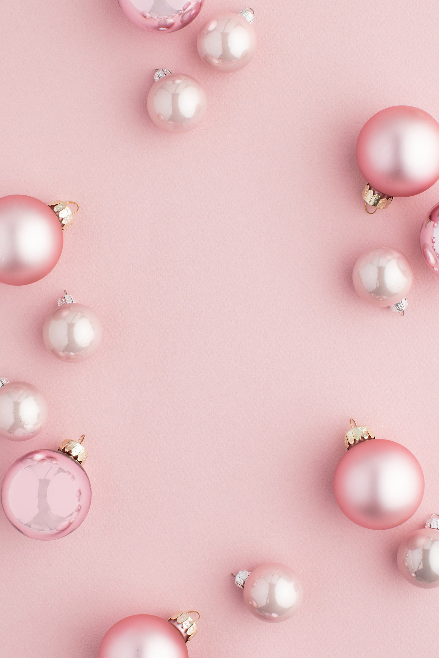 photo of pink bulb ornaments sitting on a pink background