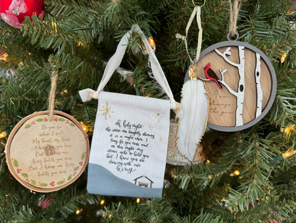 photo of 4 personalized laurelbox ornaments hanging on a Christmas tree