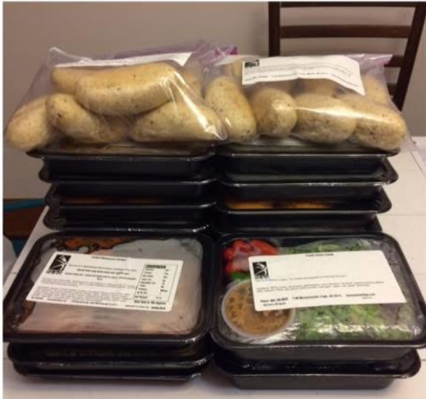 photo of stacks of prepacked food sitting on a table